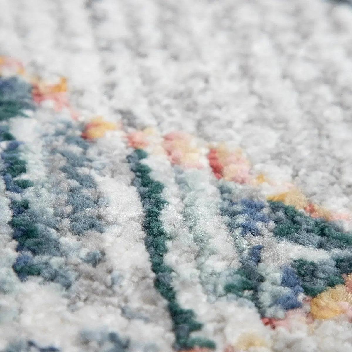 Close-up of a textured rug with multicolor pattern