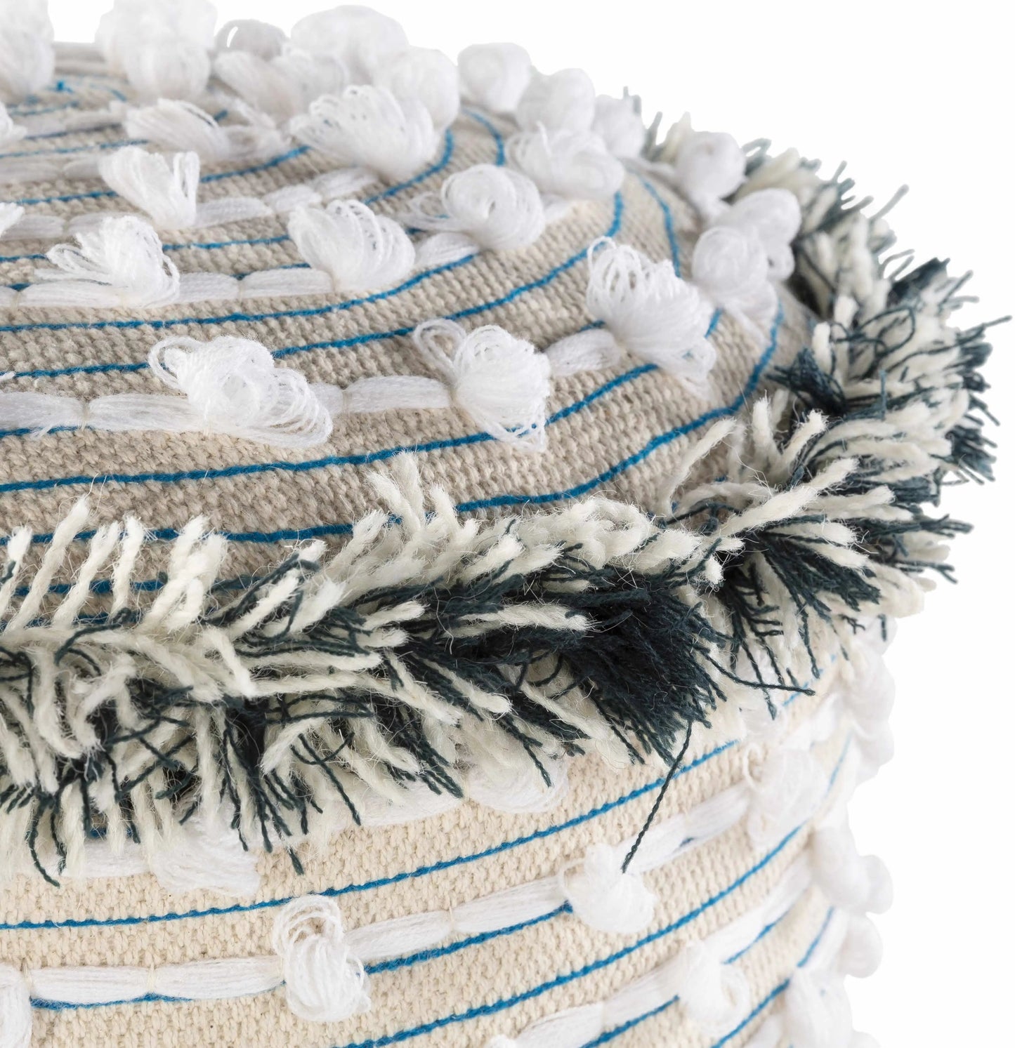 Close-up of a woven basket with tassels and decorative elements on a white background