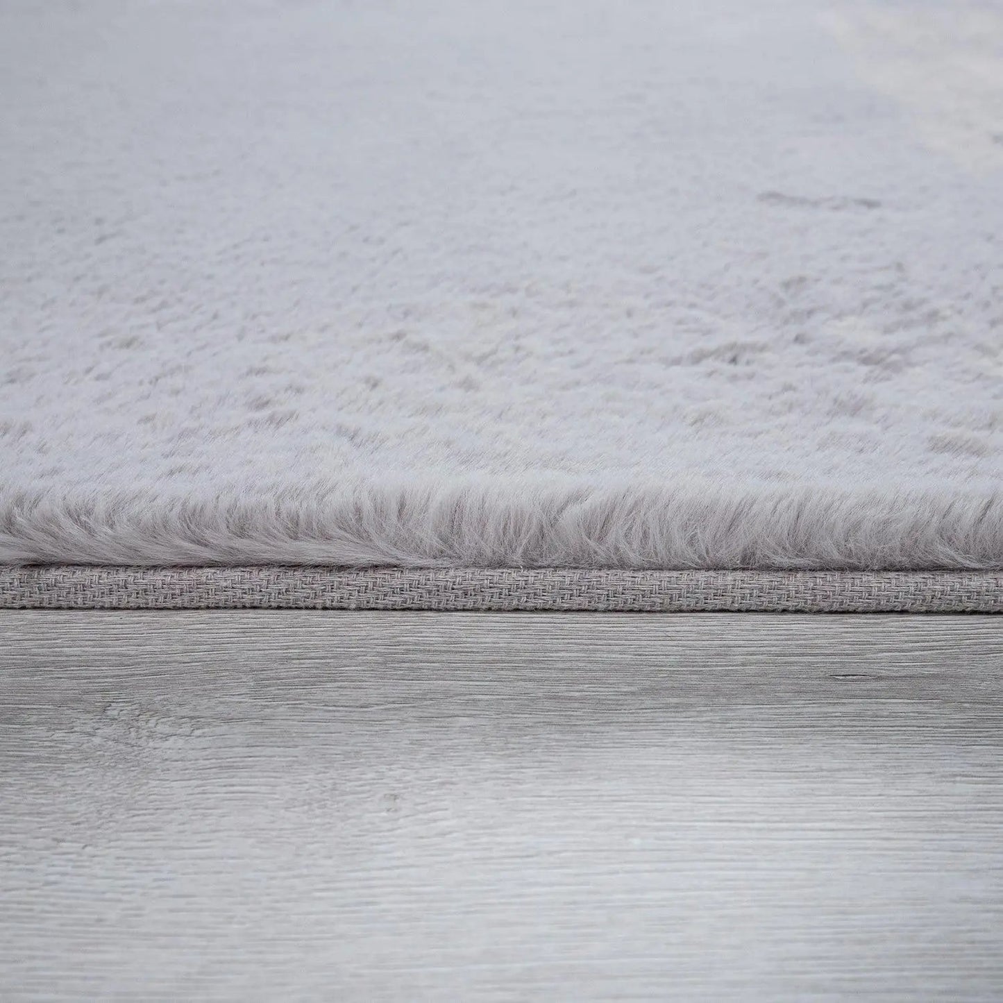 Close-up of a textured gray fabric surface
