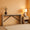 Modern console table with decorative items against a warm orange wall.