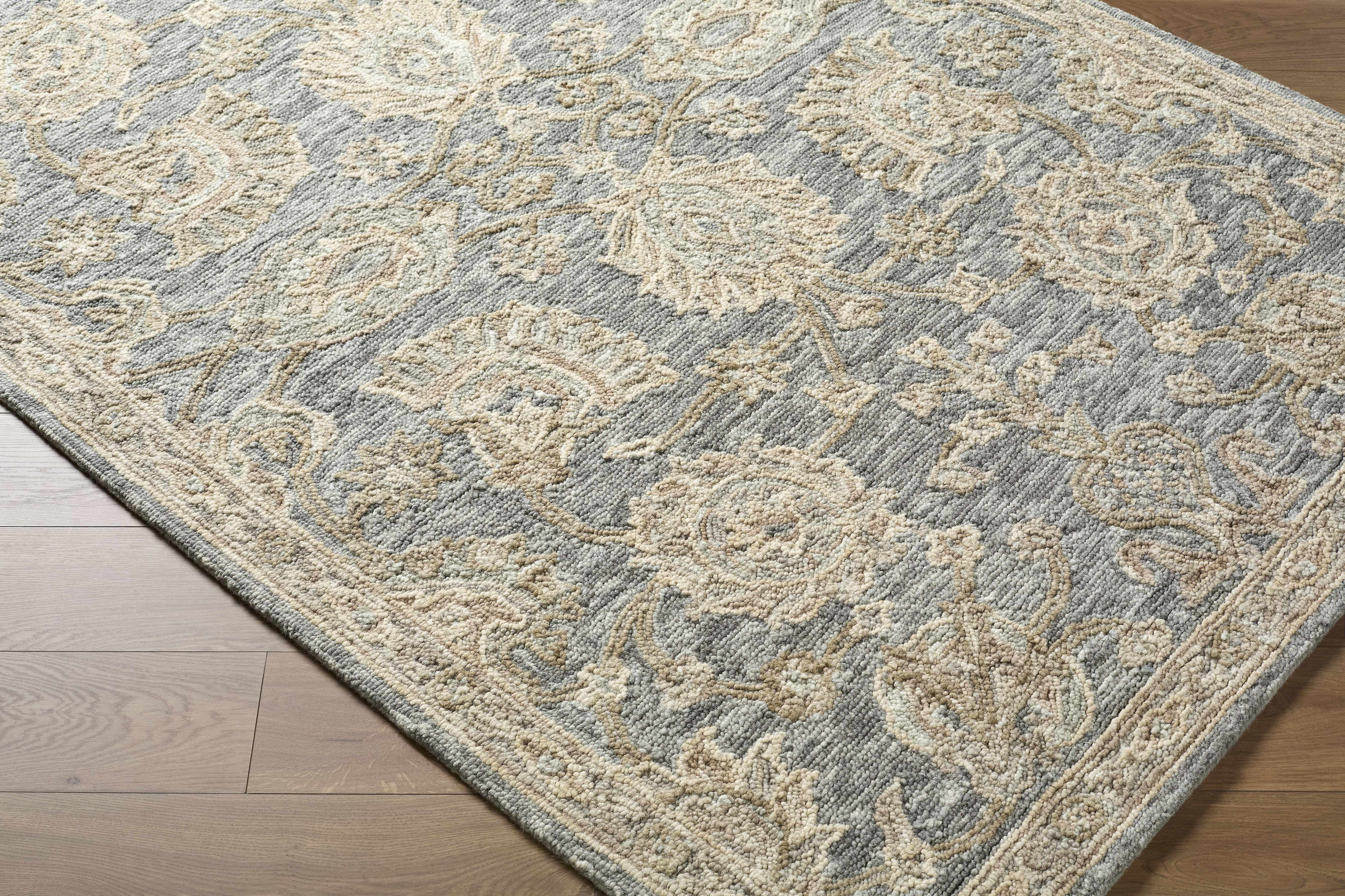 Patterned rug on a wooden floor