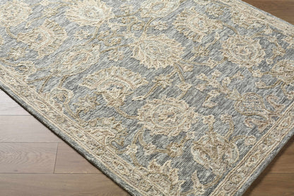 Patterned rug on a wooden floor