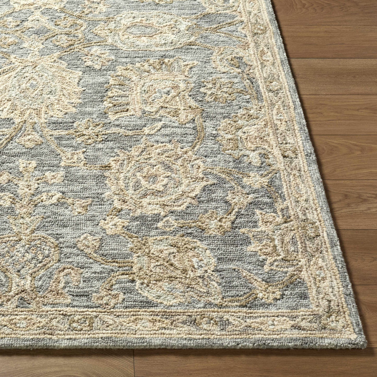 Patterned rug on a wooden floor