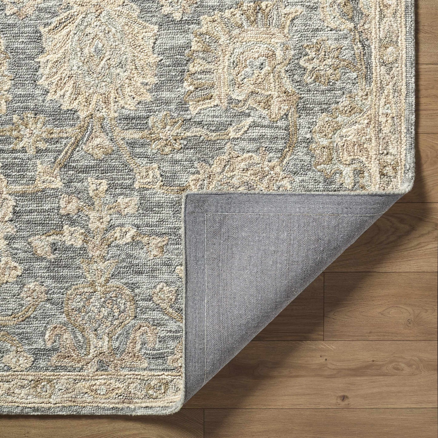 Patterned rug on a wooden floor