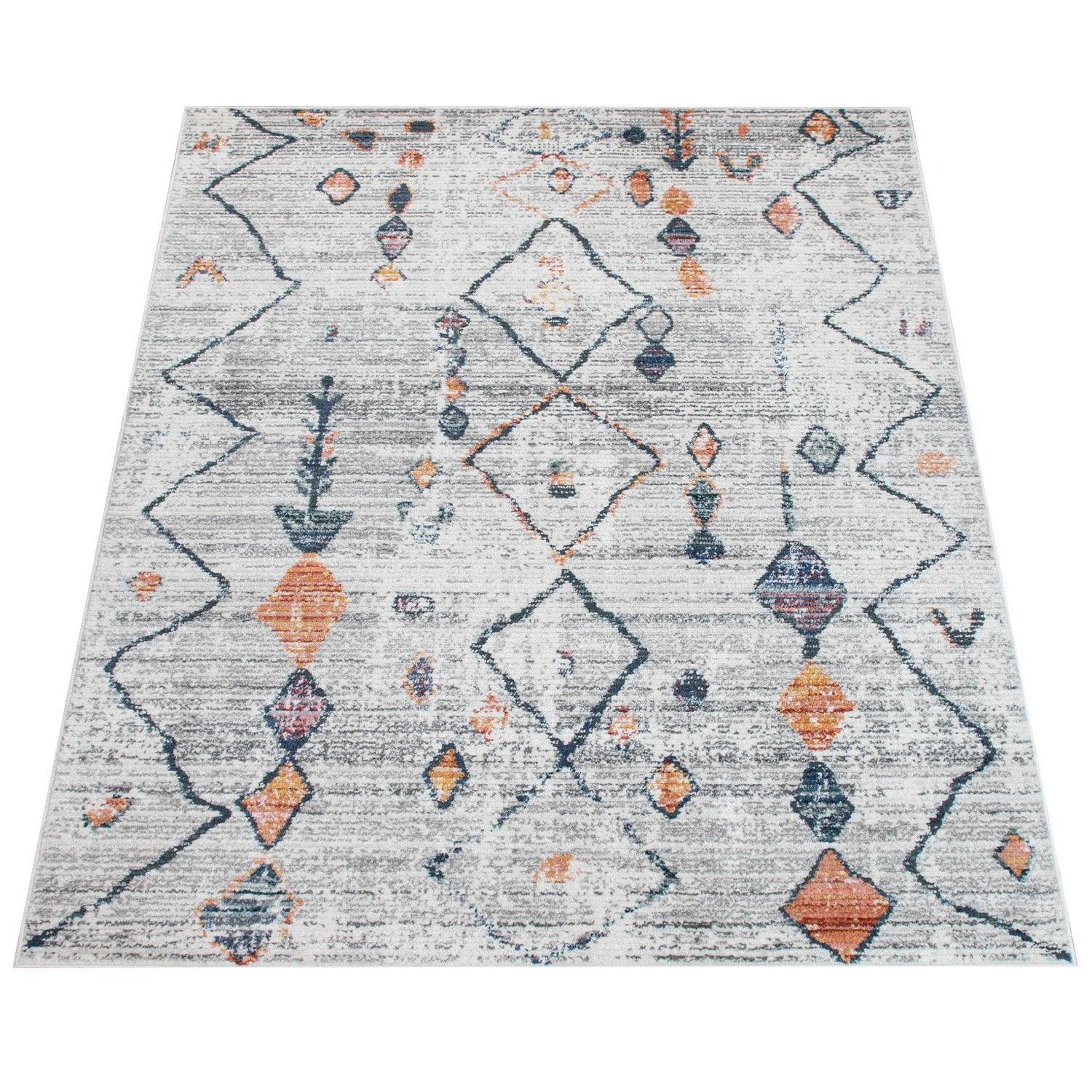 Patterned rug with geometric design on a white background