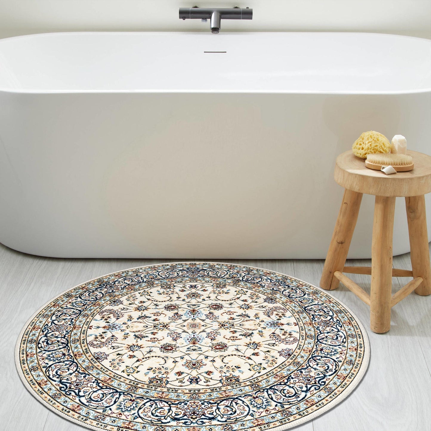 Round decorative rug with intricate patterns in a bathroom setting.