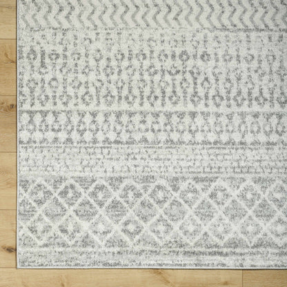 Patterned rug on a wooden floor