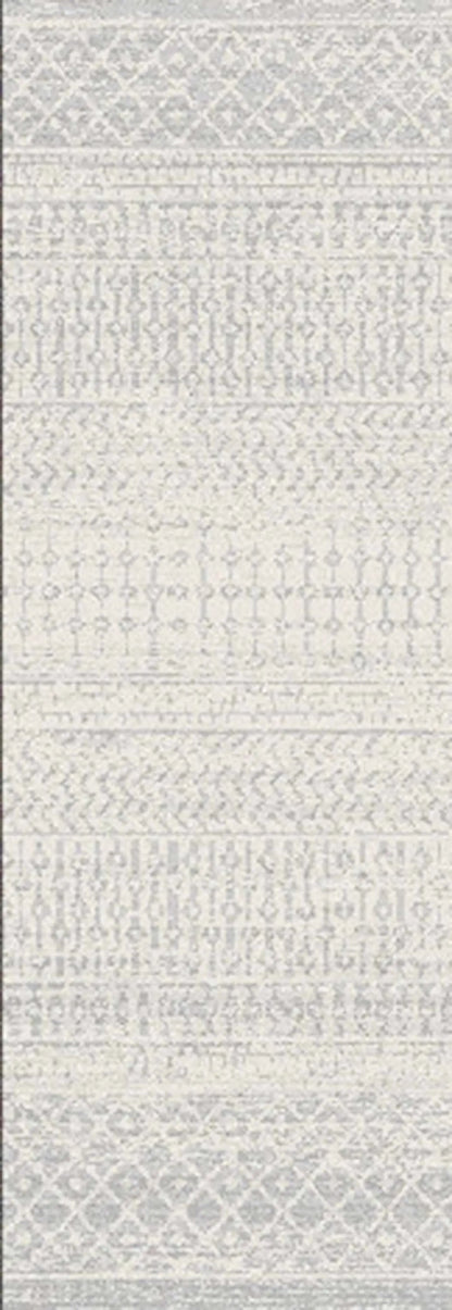 A close-up of a light gray and off-white patterned textile or rug with horizontal woven bands and geometric motifs.
