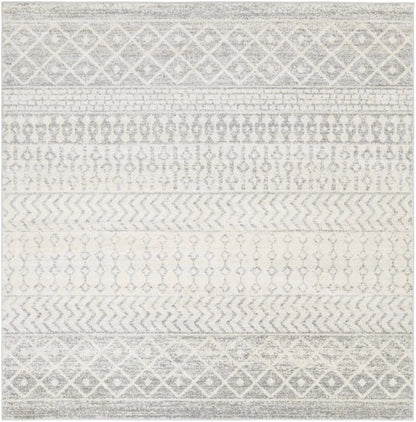 A square area rug with a distressed geometric pattern in shades of gray and off-white, featuring horizontal bands of diamond, chevron, and dot motifs.
