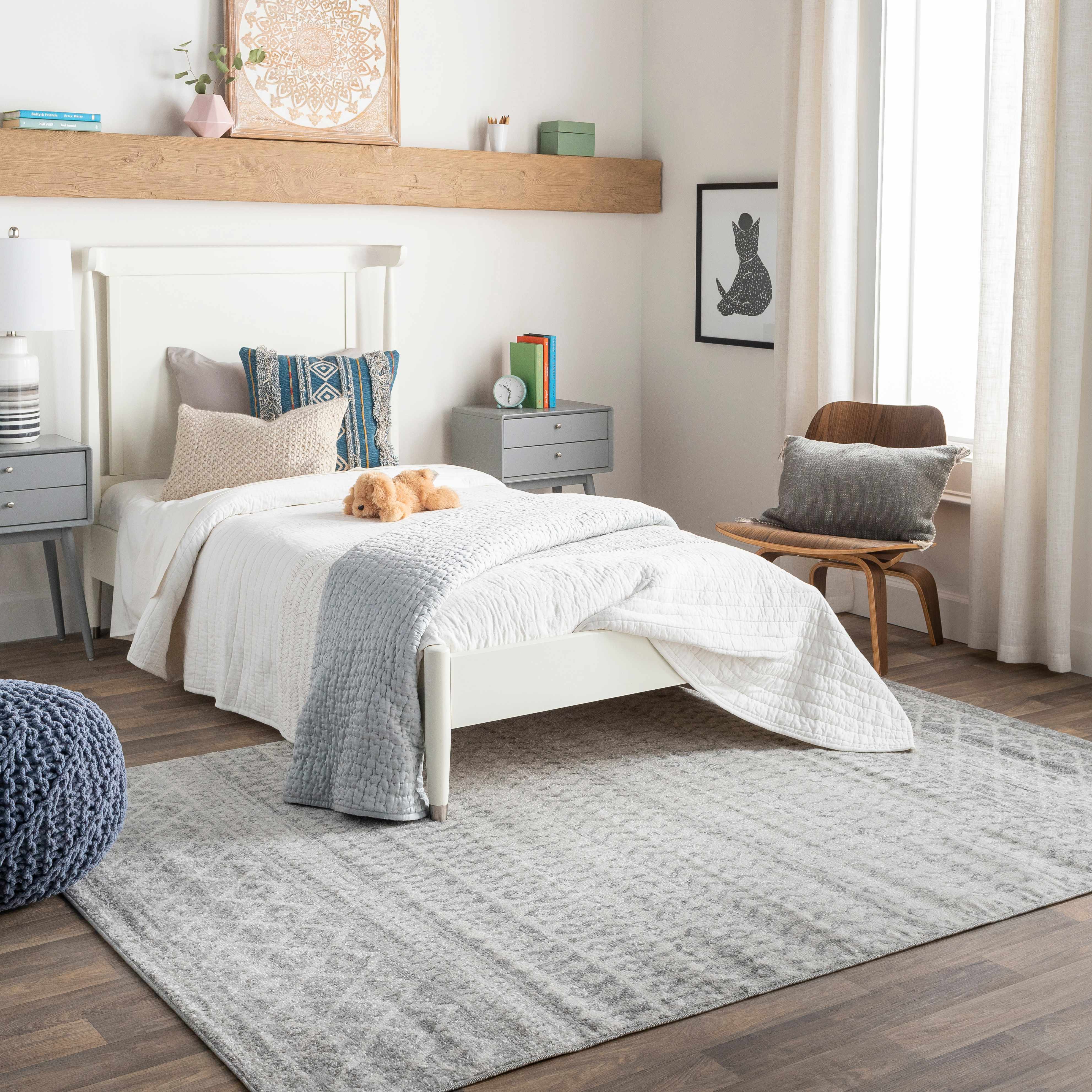 Bedroom with a bed, nightstands, and decor items.