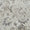 Close-up of a textured patterned rug with neutral colors.