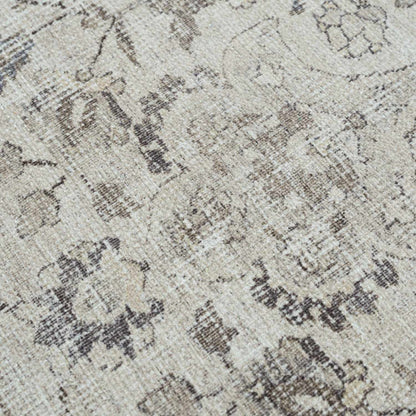 Close-up of a textured patterned rug with neutral colors.