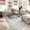 Living room with beige sofas, a wooden coffee table, and decorative elements.