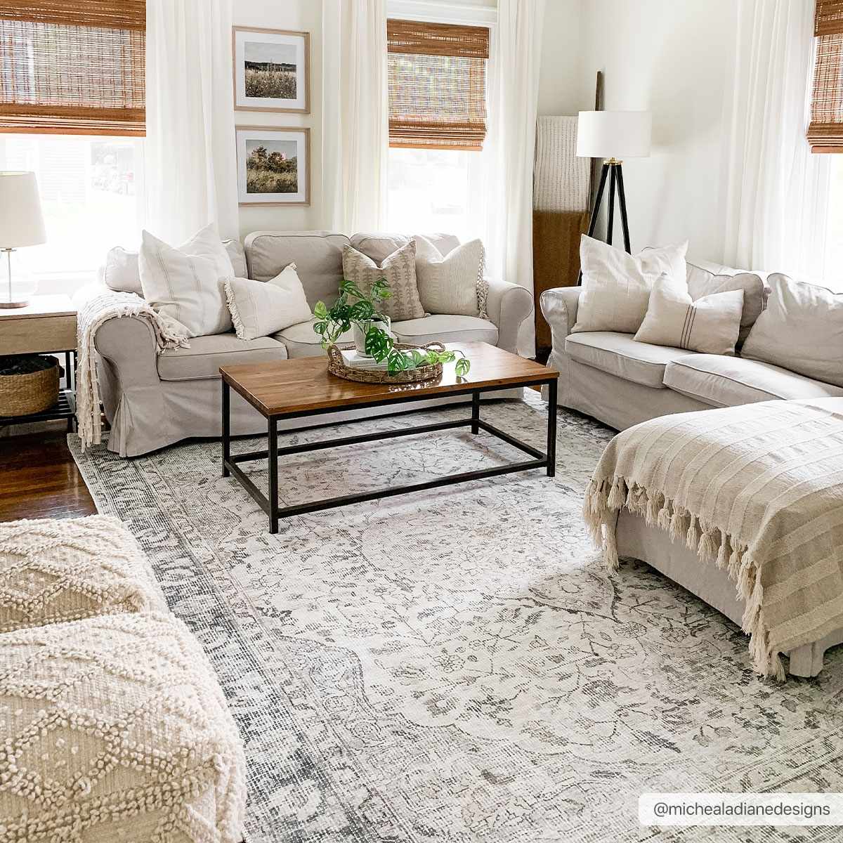 Living room with beige sofas, a wooden coffee table, and decorative elements.