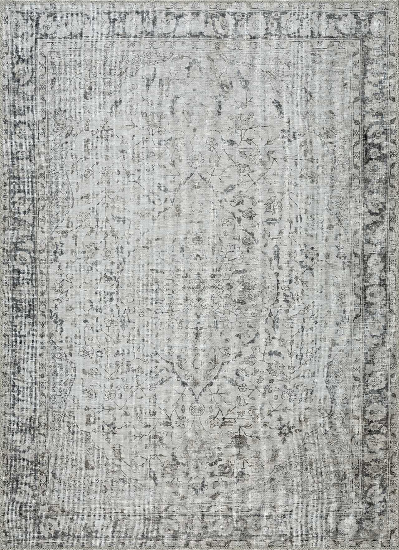 Gray area rug with decorative pattern on a plain background