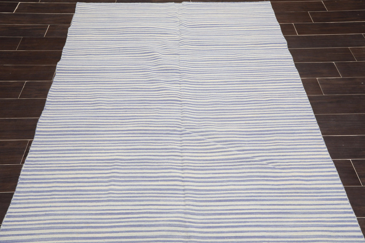 Striped rug on a wooden floor