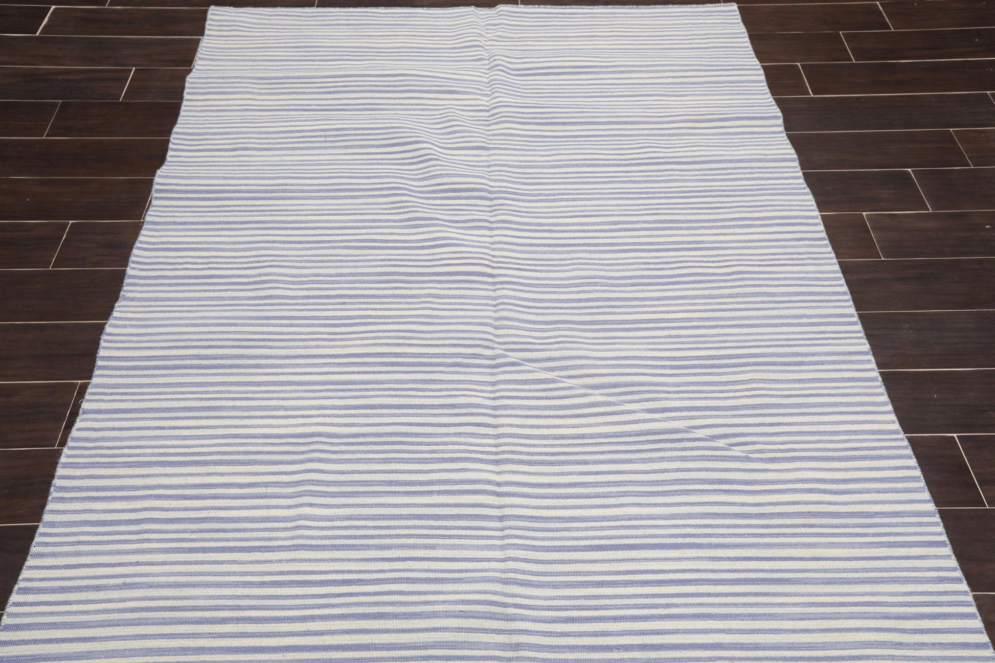 Striped rug on a wooden floor