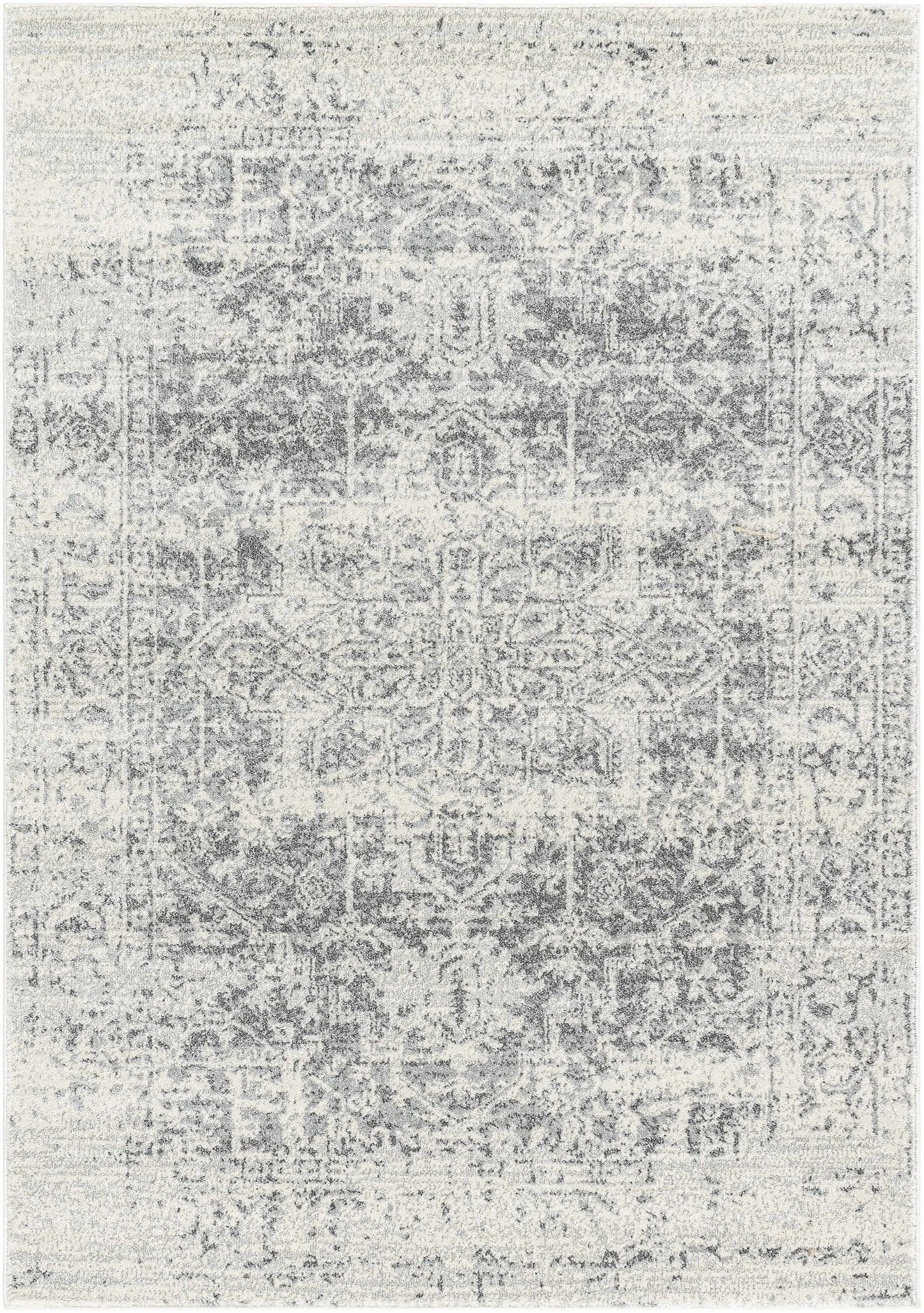 Gray and white patterned rug on a plain background
