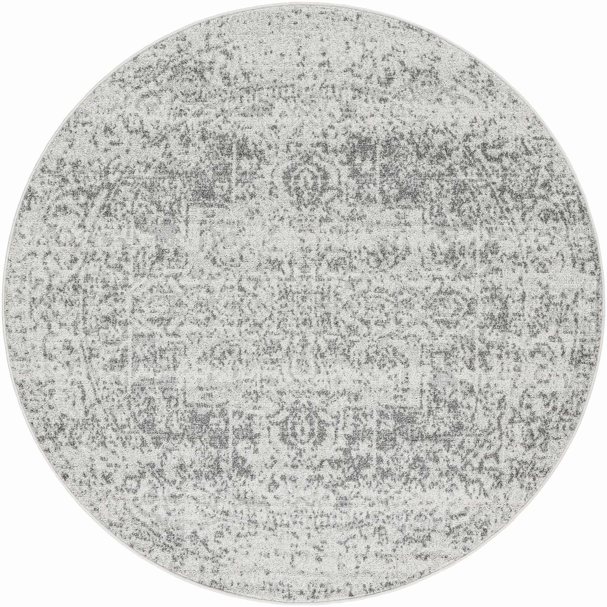 Round gray area rug with a textured pattern on a white background
