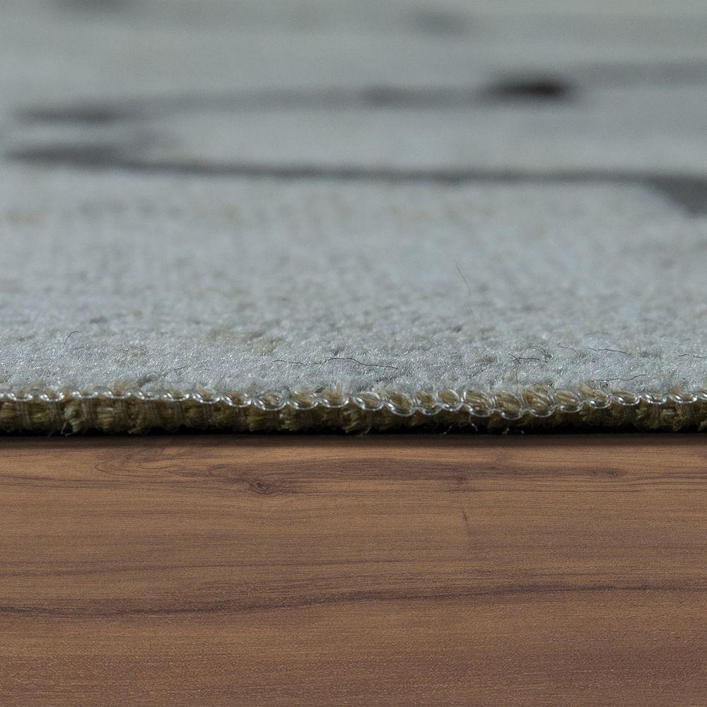 Close-up of a gray rug on a wooden floor