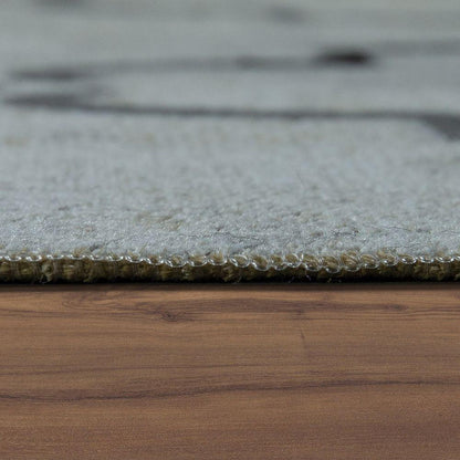 Close-up of a gray rug on a wooden floor