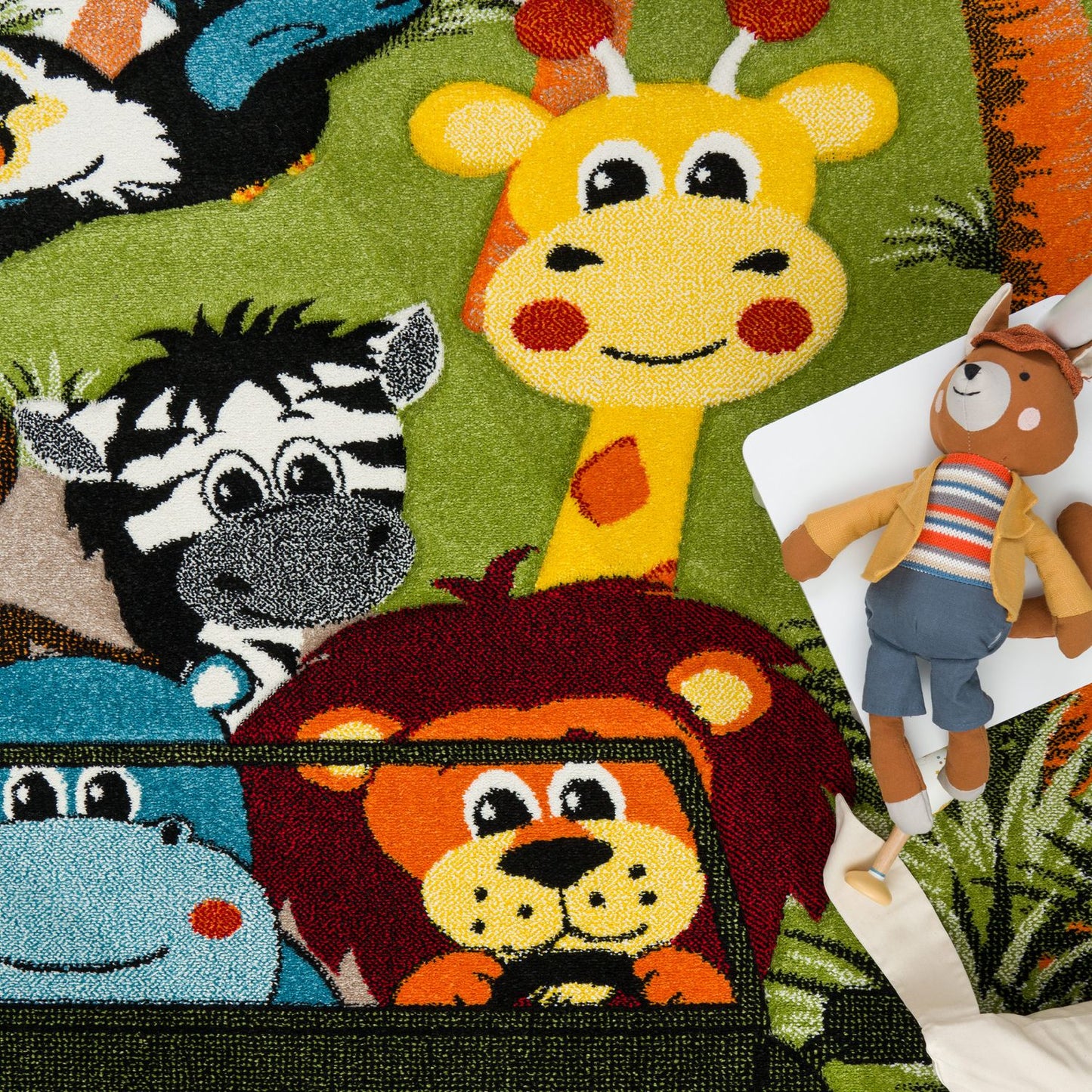 Children's rug with colorful animal illustrations including a giraffe, zebra, lion, and hippo.
