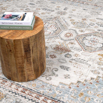 Wooden stool with a book on a patterned rug