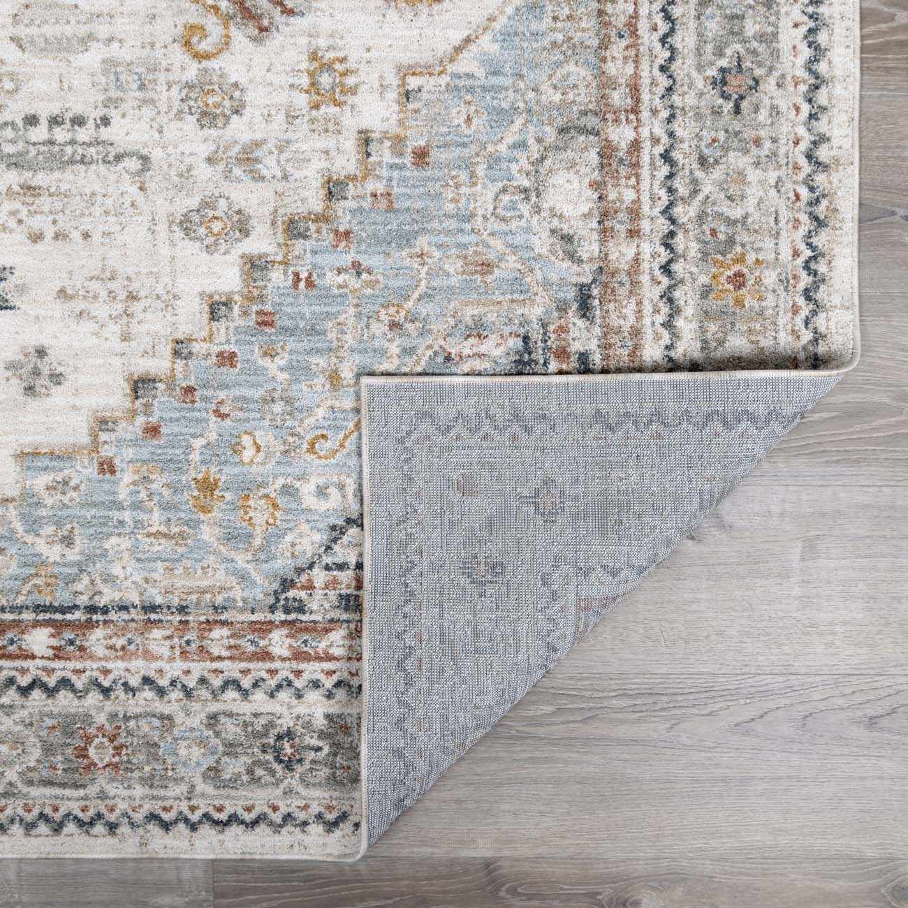 Patterned rug on a wooden floor
