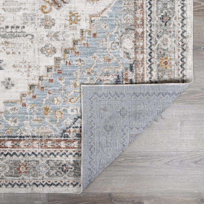 Patterned rug on a wooden floor