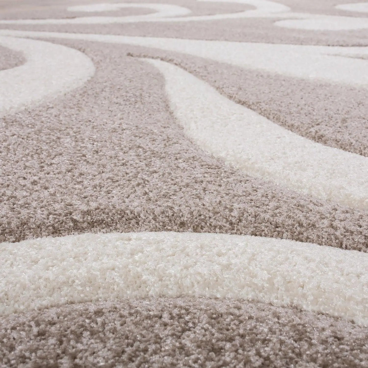 Close-up of a textured beige and brown carpet