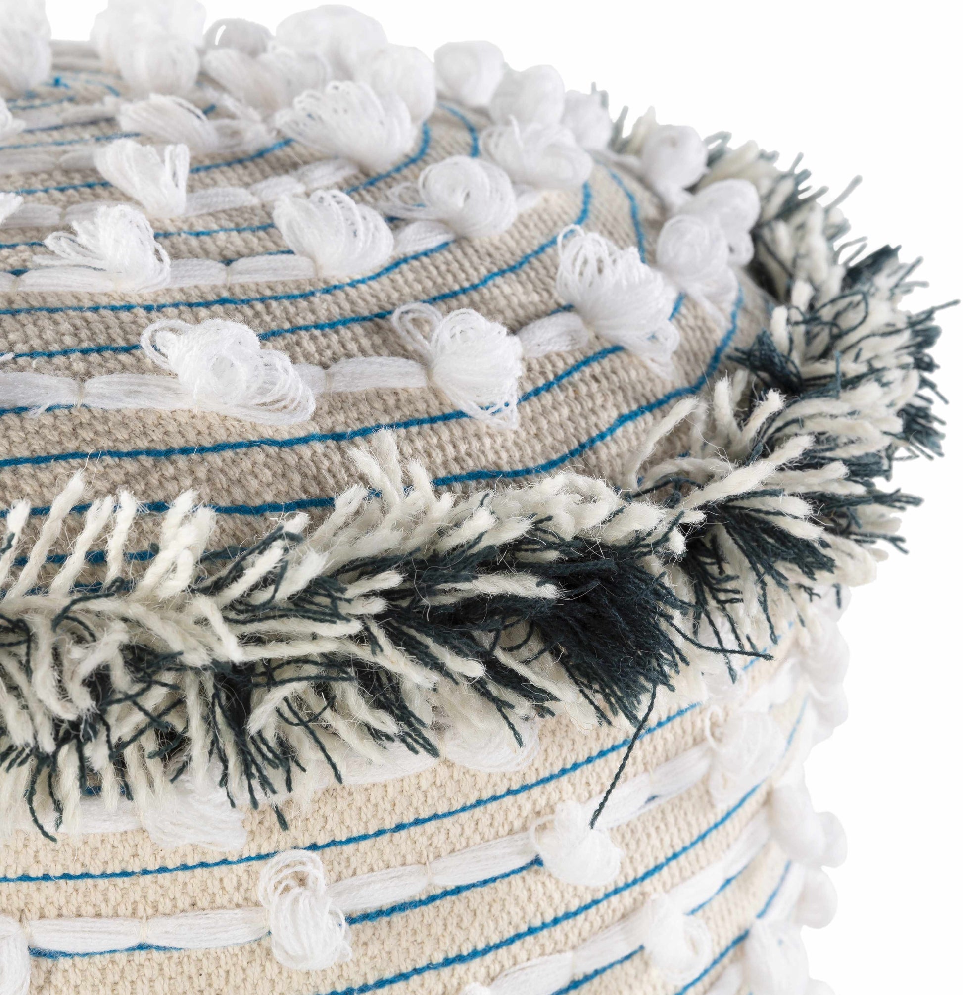 Close-up of a woven basket with tassels and decorative elements on a white background