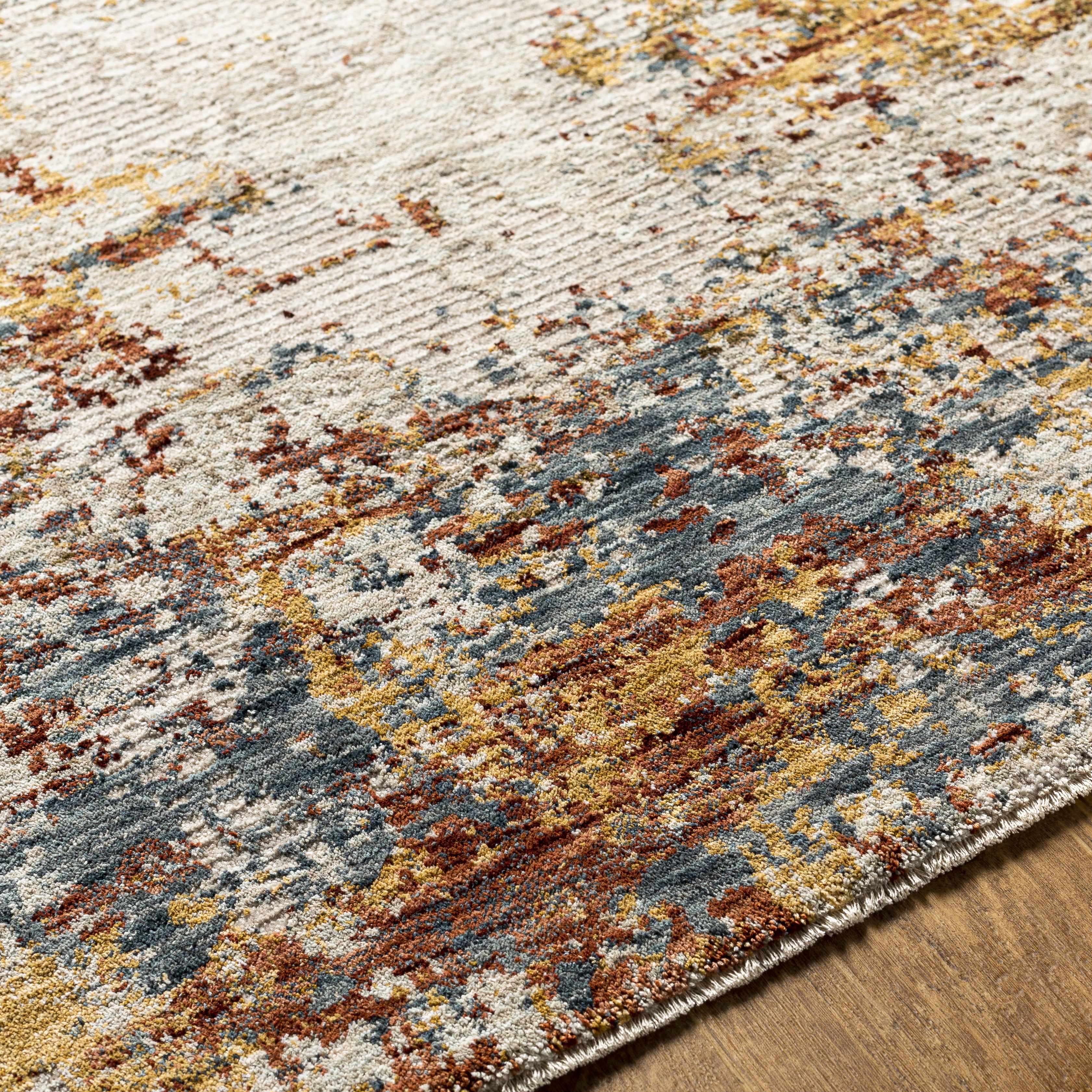 Multicolored textured rug on a wooden floor