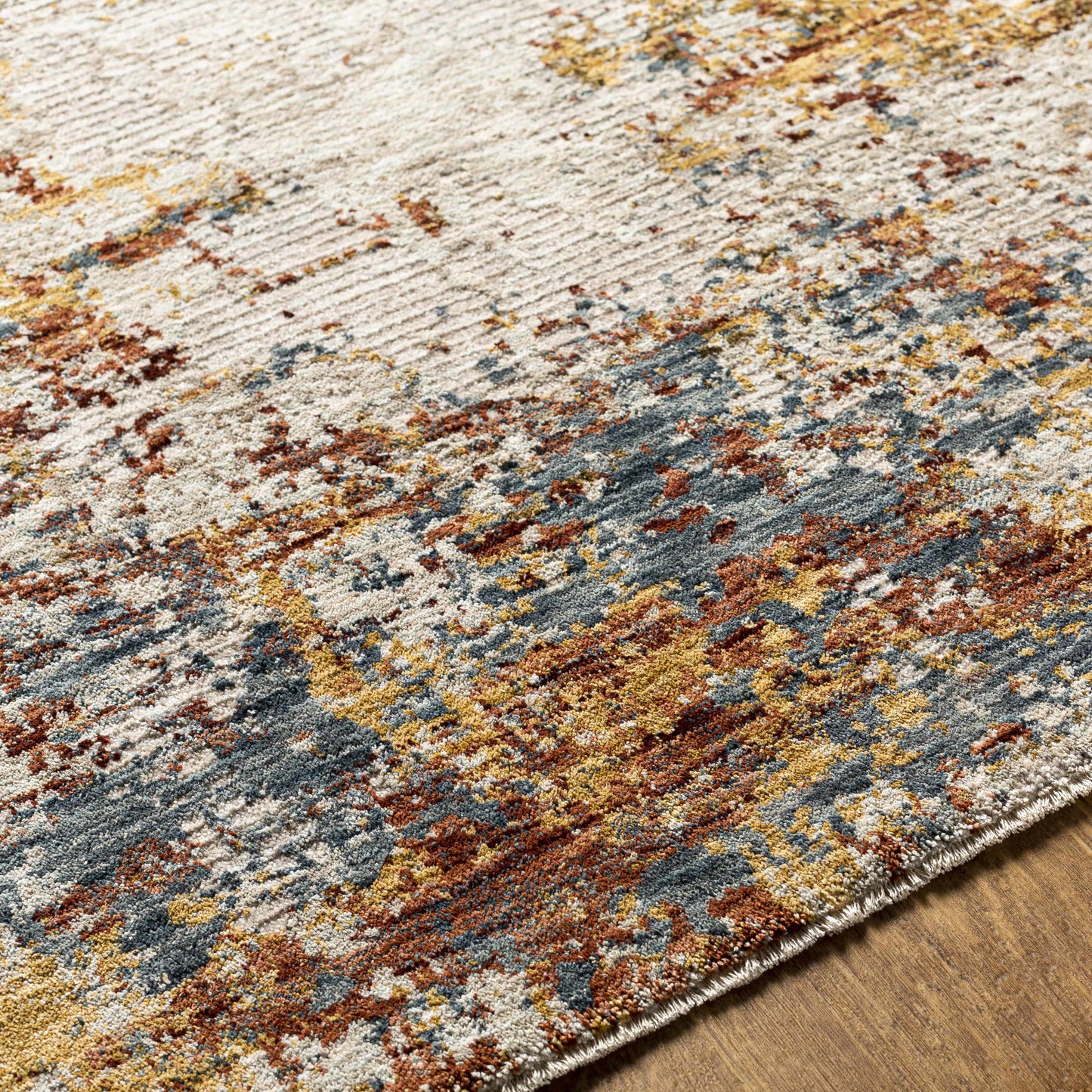 Multicolored textured rug on a wooden floor