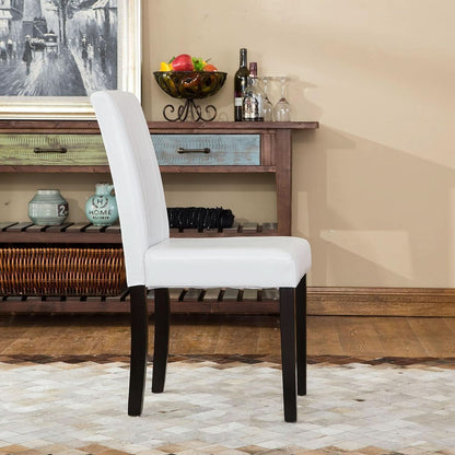 White chair in a room with wooden furniture and decor