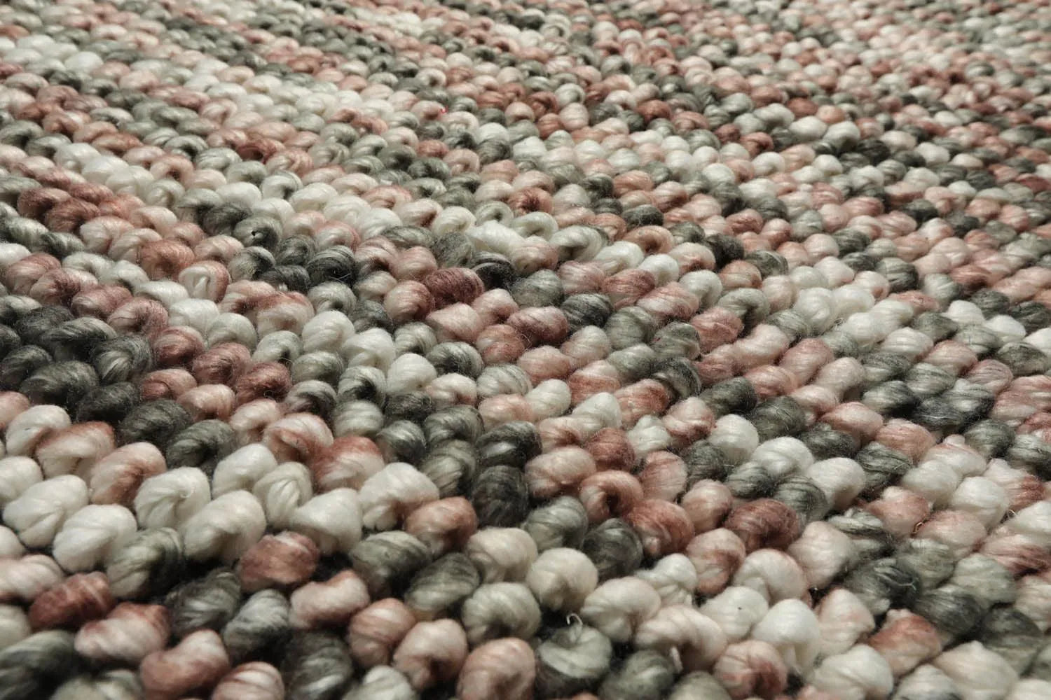 Close-up of a textured rug with multicolor pattern