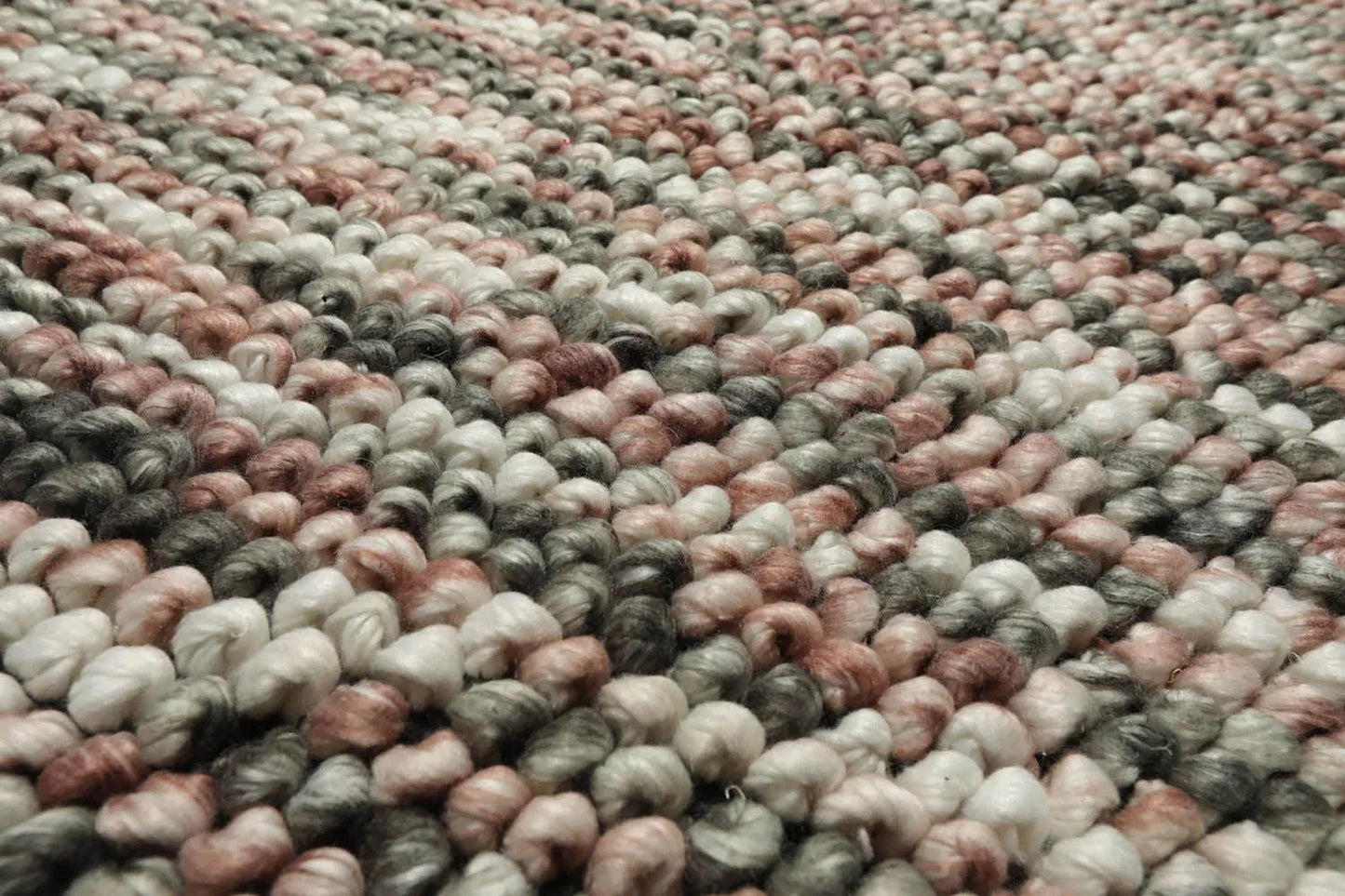 Close-up of a textured rug with multicolor pattern