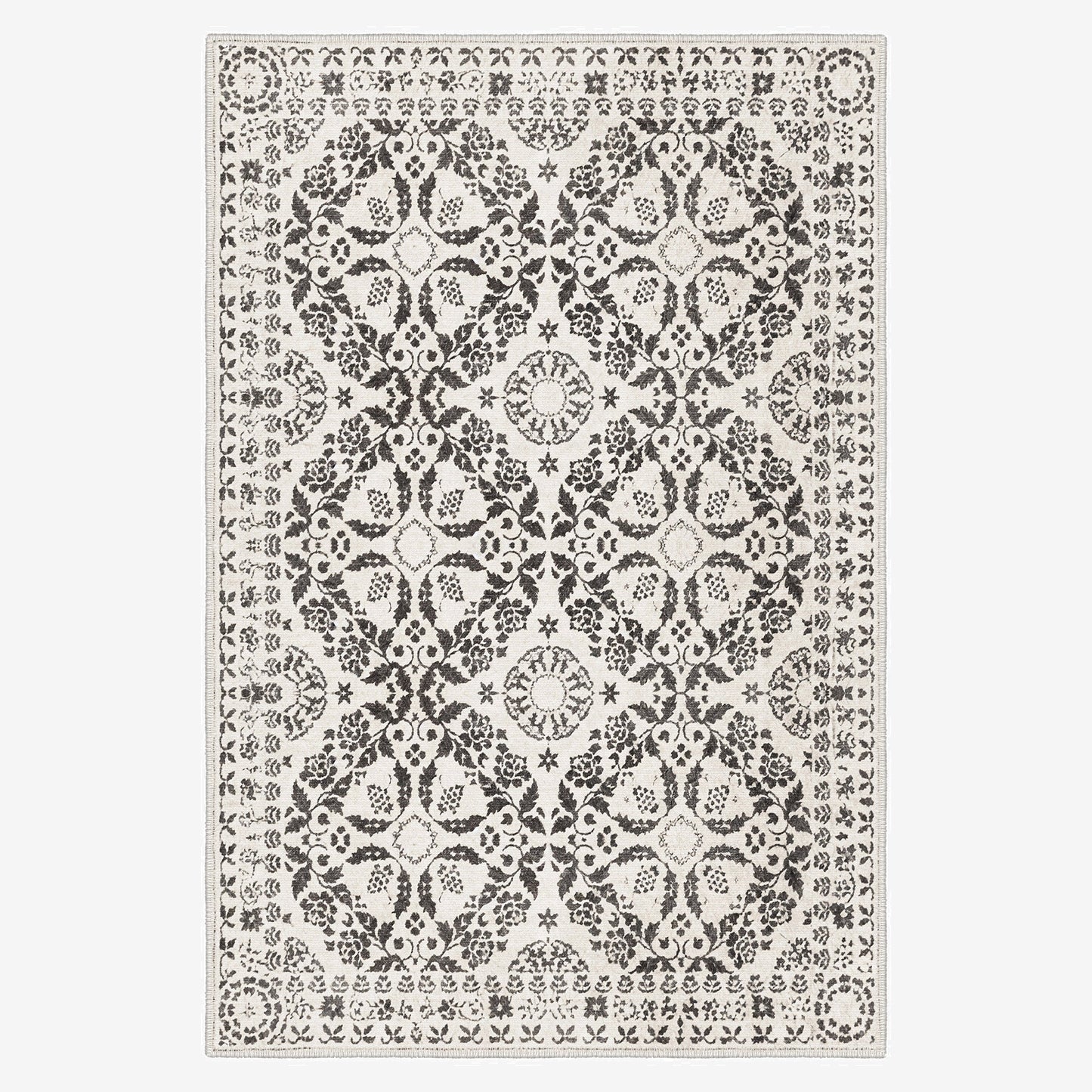 Decorative rug with a black and white pattern on a plain background