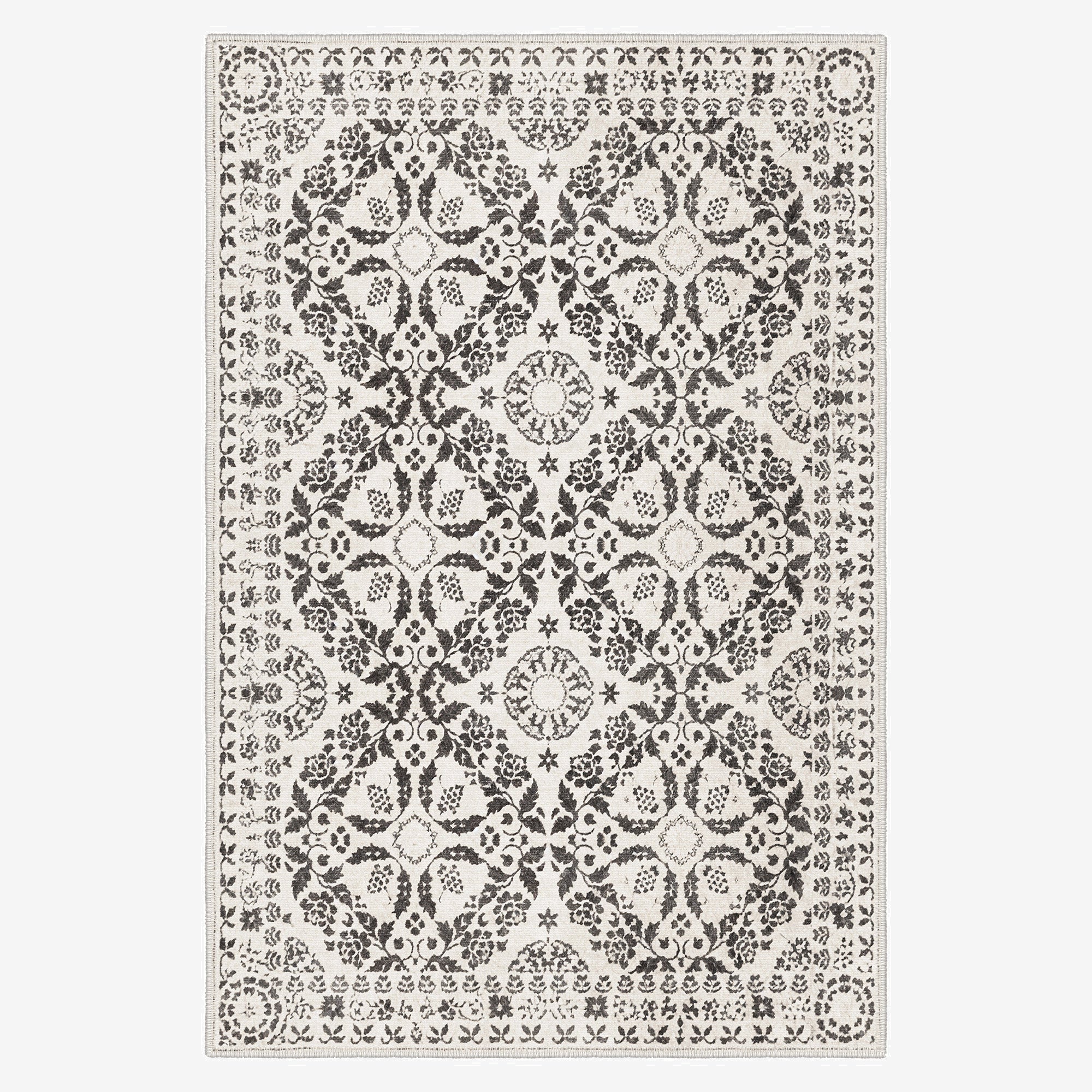 Decorative rug with a black and white pattern on a plain background