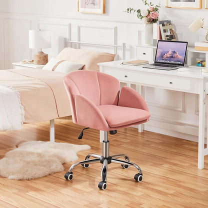 Pink office chair in a bedroom setting with a desk and laptop.
