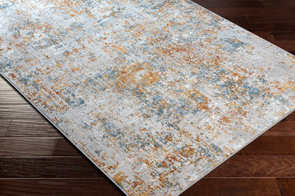 Patterned rug on a wooden floor