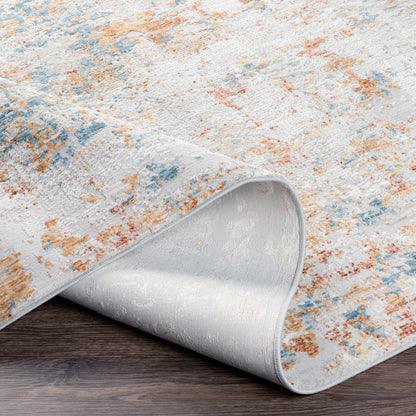Rolled-up area rug with a textured pattern on a wooden floor