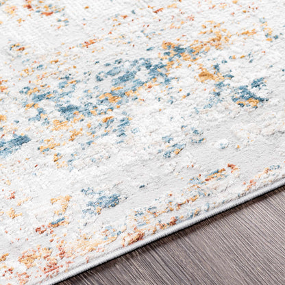 Textured area rug with multicolor pattern on a wooden floor