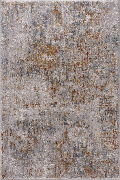 Patterned rug with brown and gray colors on a plain background