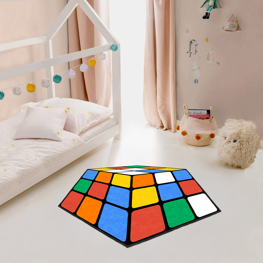 Colorful geometric rug on a light-colored floor in a room with a bed and decorative elements.