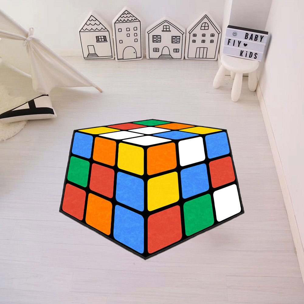 Colorful Rubik's Cube-shaped rug on a light wooden floor with decorative houses in the background.