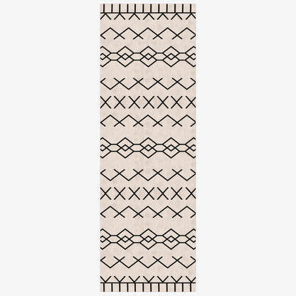 Beige runner rug with black geometric pattern on a white background
