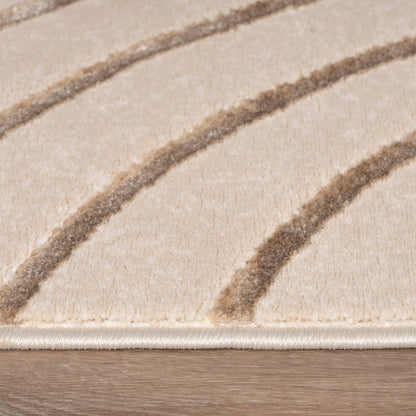Close-up of a beige rug with brown stripes on a wooden floor.