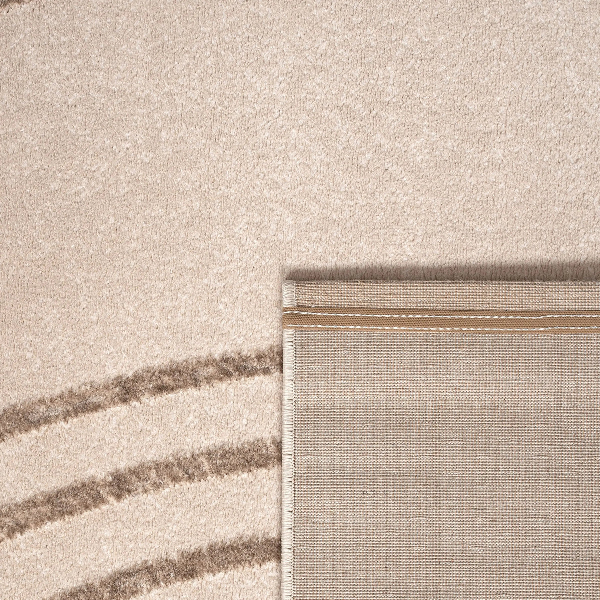 Close-up of a textured fabric with horizontal stripes in beige and brown.