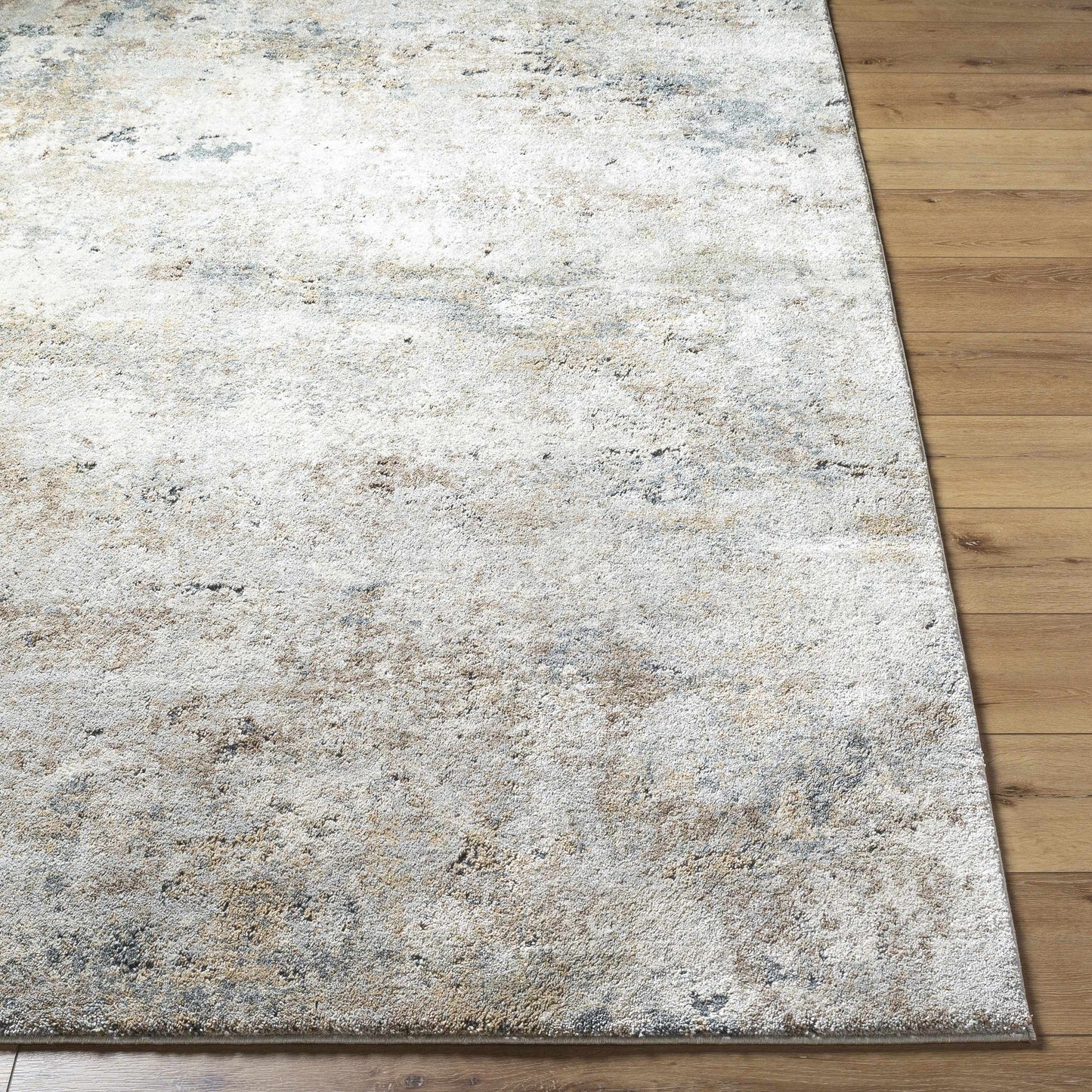 Gray area rug on a wooden floor