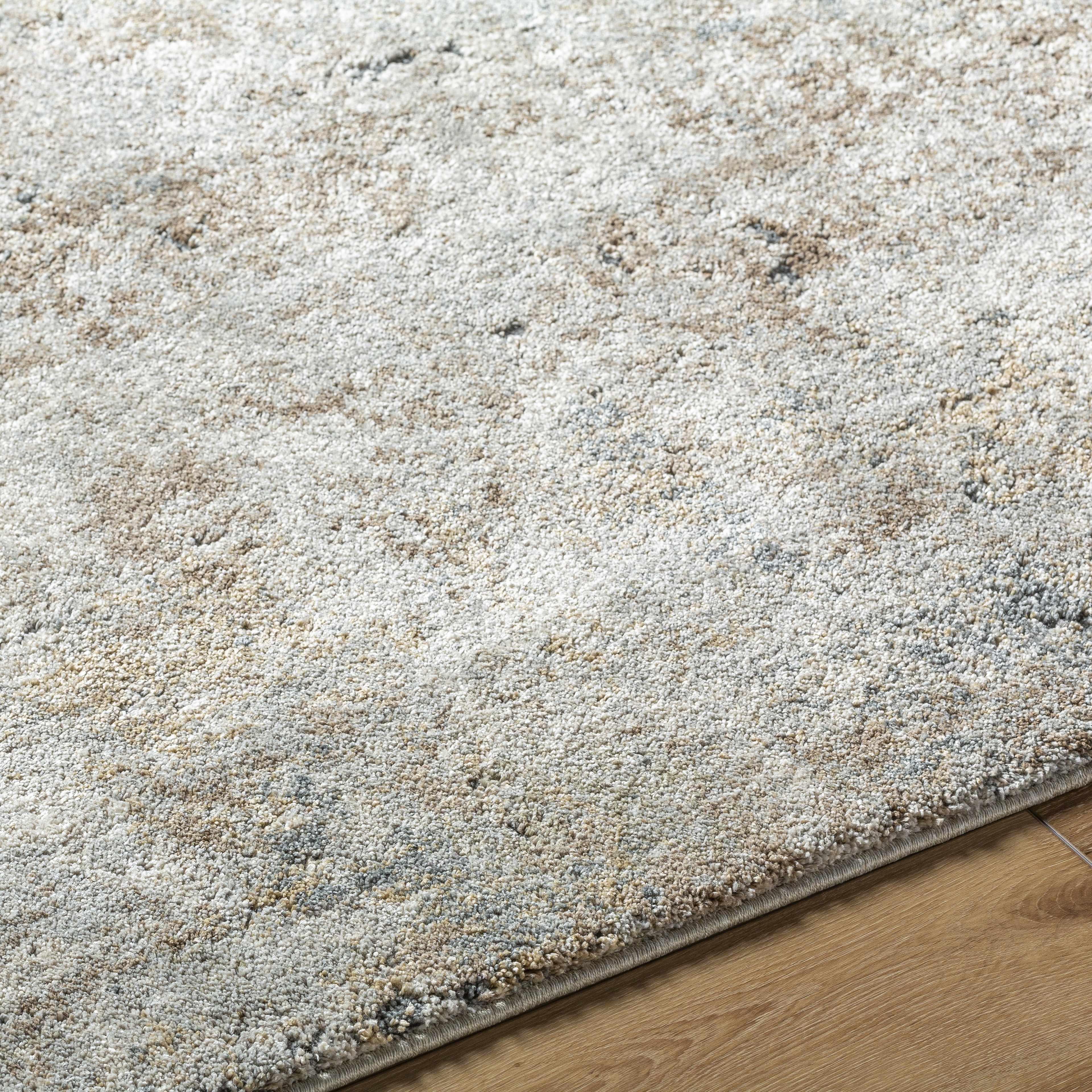 Textured area rug on a wooden floor